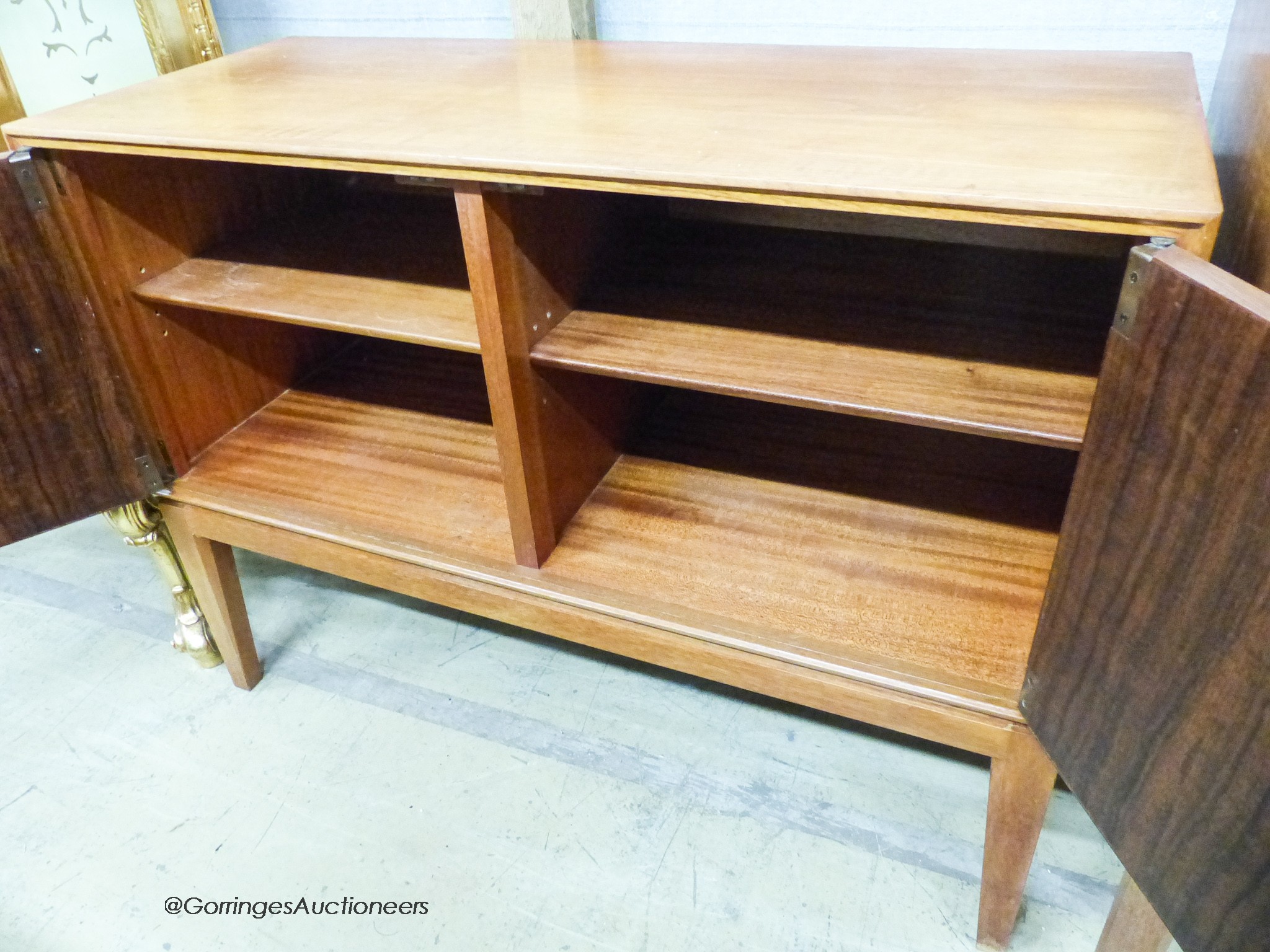 A Gordon Russell Ltd teak and Indian laurel 2 door side cabinet, model R 803 circa 1960, length 101cm, depth 42cm, height 77cm